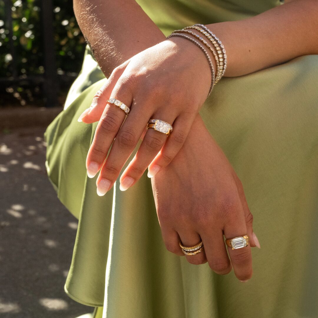 Spring2026_Internal20-Feed-square | Frank Darling A woman in a chartreuse dress wears multiple moissanite engagement rings and jewelry